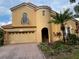 Two-story house with attractive landscaping and a large garage at 11774 Via Lucerna Cir, Windermere, FL 34786