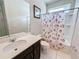 Clean bathroom with tub shower combo, vanity, and tile flooring at 1612 Herrons Green Path, Kissimmee, FL 34747