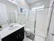 Clean bathroom with a single vanity and a walk-in shower at 1612 Herrons Green Path, Kissimmee, FL 34747