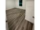 Spacious bedroom with laminate flooring and white walls at 649 Lincoln St, Kissimmee, FL 34741