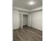 Bedroom with laminate flooring and a walk-in closet at 649 Lincoln St, Kissimmee, FL 34741