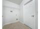 Convenient laundry room with shelving and tile floor at 744 Stonewyk Way, Kissimmee, FL 34744