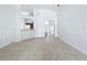 Open living area with tile flooring, a view into the kitchen and entryway at 744 Stonewyk Way, Kissimmee, FL 34744