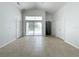 Spacious living area with tile floors and sliding glass doors to backyard at 744 Stonewyk Way, Kissimmee, FL 34744