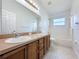 Bathroom boasts double sinks and a shower/tub combo at 744 Stonewyk Way, Kissimmee, FL 34744