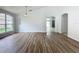 Spacious dining room with wood-look flooring and a chandelier at 744 Stonewyk Way, Kissimmee, FL 34744
