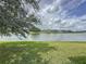Peaceful lake view with houses in the background at 744 Stonewyk Way, Kissimmee, FL 34744