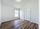 Spacious bedroom with wood-look flooring and a closet at 744 Stonewyk Way, Kissimmee, FL 34744