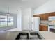 Bright kitchen with wood cabinets, ample counter space, and window overlooking backyard at 744 Stonewyk Way, Kissimmee, FL 34744