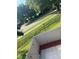 Small, fenced patio area with red mulch and partial view of street at 4009 Shannon Brown Dr, Orlando, FL 32808