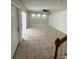 Large living room with tile floor and access to exterior at 4009 Shannon Brown Dr, Orlando, FL 32808