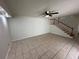 Living room with tile flooring and staircase at 4009 Shannon Brown Dr, Orlando, FL 32808