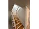 Clean, bright staircase with wood treads and white railings at 4009 Shannon Brown Dr, Orlando, FL 32808