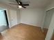 Spacious bedroom with wood floors and mirrored closet doors at 4009 Shannon Brown Dr, Orlando, FL 32808