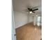 Bedroom with wood floors, mirrored closet, and ceiling fan at 4009 Shannon Brown Dr, Orlando, FL 32808