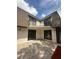 Back exterior view of townhouse with patio and balcony at 4009 Shannon Brown Dr, Orlando, FL 32808