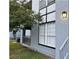 Building exterior showcasing a gray facade and landscaping at 3701 Castle Pines Ln # 3914, Orlando, FL 32839