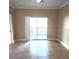 Bright living room with tile flooring and sliding glass doors at 3701 Castle Pines Ln # 3914, Orlando, FL 32839
