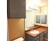 Clean bathroom with vanity, sink, and medicine cabinet at 3701 Castle Pines Ln # 3914, Orlando, FL 32839