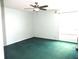 Bright bedroom with green carpet and ceiling fan at 348 Jacksonville Ct, Kissimmee, FL 34759
