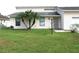 House exterior with a one-car garage and palm trees at 348 Jacksonville Ct, Kissimmee, FL 34759