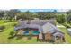 Brick home with a large pool and screened enclosure at 4147 Boggy Creek Rd, Kissimmee, FL 34744