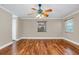 Hardwood floor bedroom with window and ceiling fan at 4147 Boggy Creek Rd, Kissimmee, FL 34744
