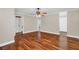 Bright bedroom with hardwood floors and ceiling fan at 4147 Boggy Creek Rd, Kissimmee, FL 34744