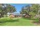 Ranch style brick home with walkway and lush landscaping at 4147 Boggy Creek Rd, Kissimmee, FL 34744