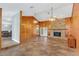 Large living room with vaulted ceilings, tile floors, and a brick fireplace at 4147 Boggy Creek Rd, Kissimmee, FL 34744