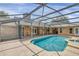 Inviting screened pool and spa with brick pavers at 4147 Boggy Creek Rd, Kissimmee, FL 34744