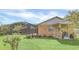 Brick home with covered porch, screened pool, and spacious backyard at 4147 Boggy Creek Rd, Kissimmee, FL 34744