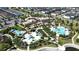 Community clubhouse and resort-style pool with surrounding homes at 1612 Herrons Green Path, Kissimmee, FL 34747