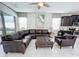 Open concept Gathering room with a sectional sofa and access to the backyard at 1612 Herrons Green Path, Kissimmee, FL 34747