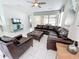 Spacious Gathering room with leather furniture and large TV at 1612 Herrons Green Path, Kissimmee, FL 34747
