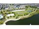 Community boasts a lake, sports courts, and open green spaces at 1612 Herrons Green Path, Kissimmee, FL 34747
