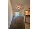 Living room with carpet, ceiling fan, and kitchen view at 1916 Lake Atriums Cir # 46, Orlando, FL 32839