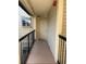 Well-lit hallway with neutral walls and access to condo unit at 1916 Lake Atriums Cir # 46, Orlando, FL 32839