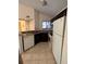 Kitchen with dark cabinets and white appliances at 1916 Lake Atriums Cir # 46, Orlando, FL 32839