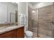 Clean bathroom with shower, toilet and granite vanity at 280 Pendant Ct, Kissimmee, FL 34747