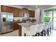 Modern kitchen with stainless steel appliances and granite countertops at 280 Pendant Ct, Kissimmee, FL 34747