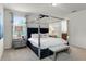 Primary bedroom with canopy bed and ensuite bathroom at 280 Pendant Ct, Kissimmee, FL 34747