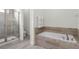 Modern bathroom with soaking tub and separate shower at 280 Pendant Ct, Kissimmee, FL 34747