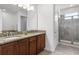 Elegant bathroom with double sinks, granite countertop and large shower at 280 Pendant Ct, Kissimmee, FL 34747