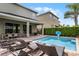 Private pool with lounge chairs and patio furniture at 280 Pendant Ct, Kissimmee, FL 34747