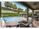 Relaxing pool area with lounge chairs and fire pit at 280 Pendant Ct, Kissimmee, FL 34747