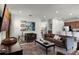 Open concept living room with brown couches and kitchen view at 280 Pendant Ct, Kissimmee, FL 34747