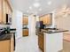 Spacious kitchen with stainless steel appliances and an island at 722 Coronado Dr, Kissimmee, FL 34759