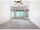 Spacious bedroom with large windows and ceiling fan at 722 Coronado Dr, Kissimmee, FL 34759