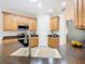 Modern kitchen with double sink, granite countertop, and stainless steel appliances at 722 Coronado Dr, Kissimmee, FL 34759